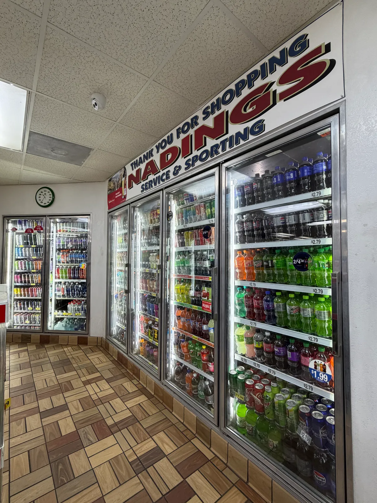 Coolers and convenience aisles inside Nading's